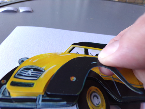 gros plan sur les mains qui mettre une couche de papier sur une autre pour faire un sujet en volume 3D pour faire un 2 chevaux ancienne les papillons apprivoises